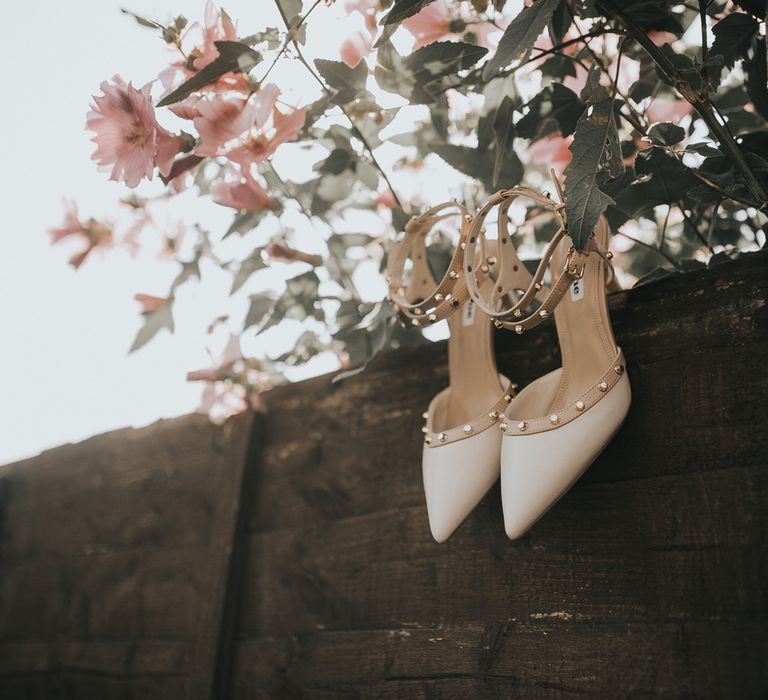 Studded neutral wedding shoes. 