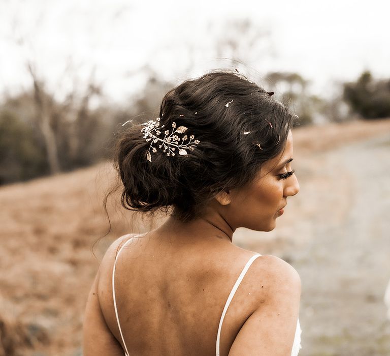 Indian Bride with a pinned up do and hair vine 