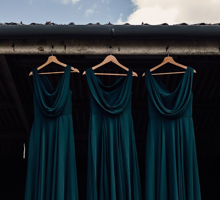 TH&TH Bridesmaid gowns in emerald green with cowl necks