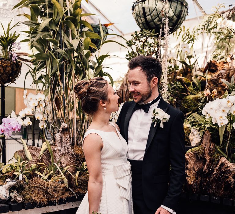 Bride & groom kiss outdoors on their wedding day