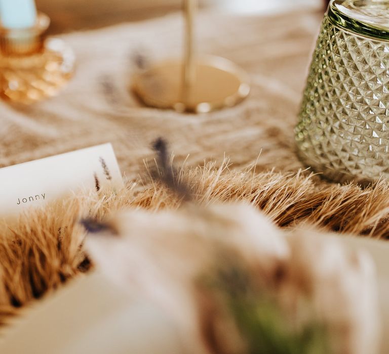 White table plate names with printed name on rustic wedding table at garden wedding reception