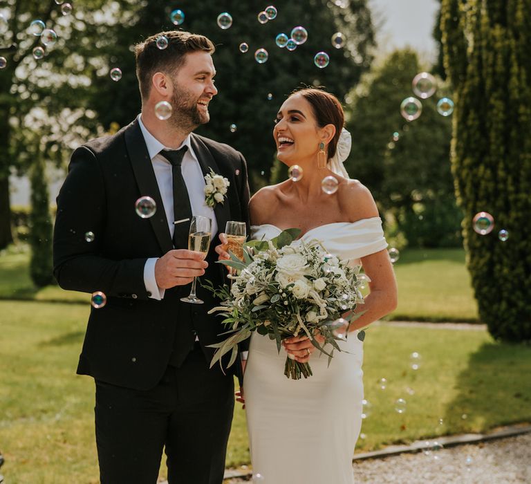 Bride and groom with bubbles and champagne at Irish wedding