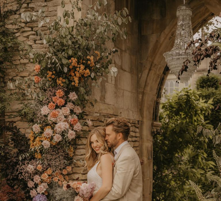 Summer wedding inspiration at Euridge Manor with Made With Love dresses, orange, coral, pink and peach flowers and iridescent tableware 