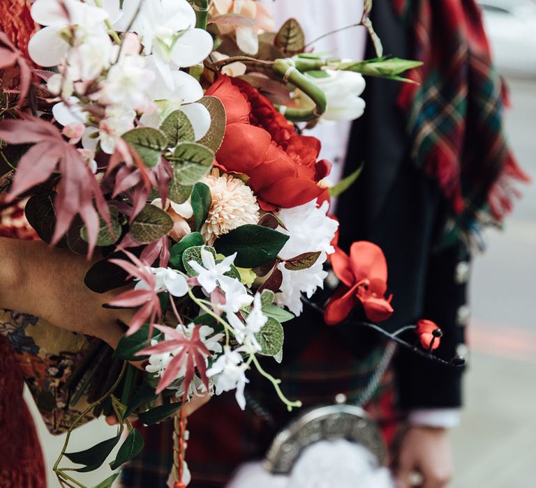 White and red wedding bouquet for bride at town hall wedding in London