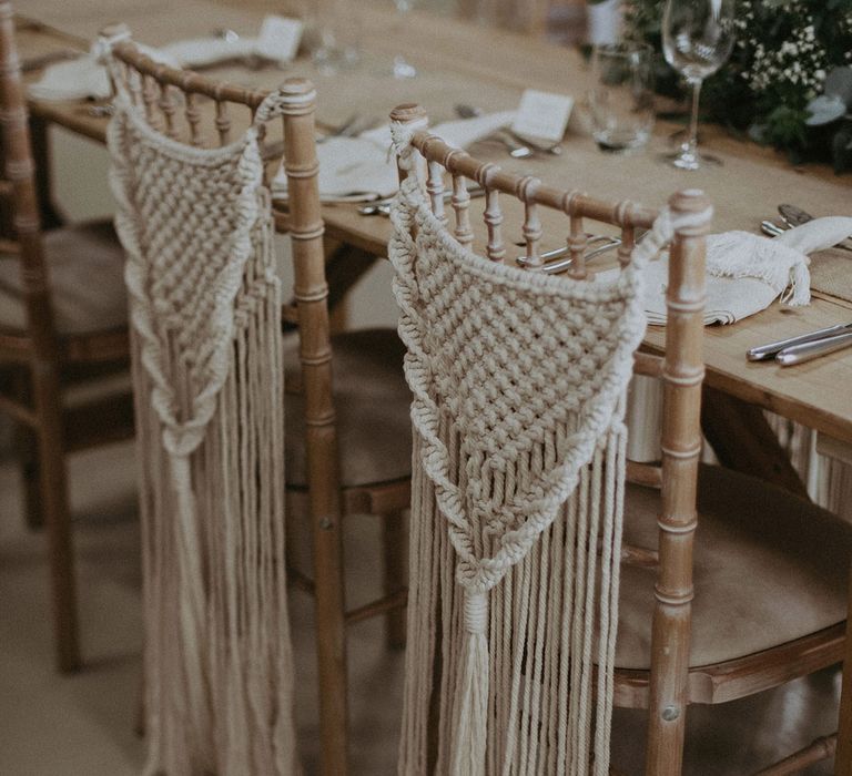 Two bamboo chairs with macrame chair hangings for Isle of Wight wedding with macrame wedding decor