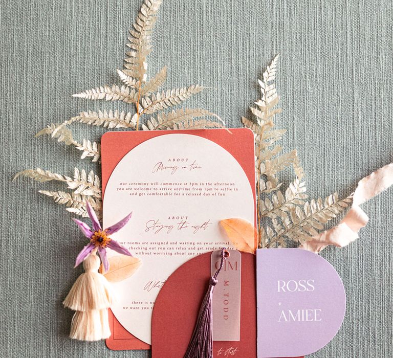 Burgundy and purple wedding stationary with fringing for retro meets modern wedding shoot