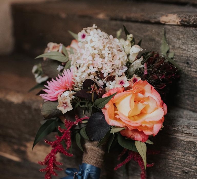 Beautiful bouquet for bride tied with blue ribbon