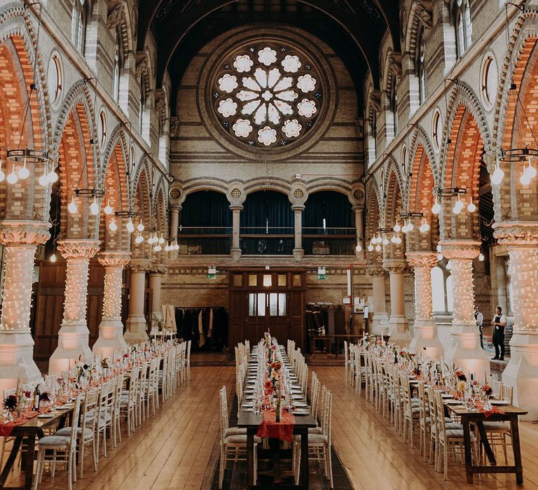 Grand church for wedding reception complete with wooden tables 