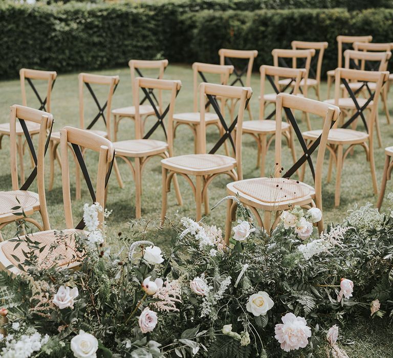 Pink and white wedding flower decor for the outdoor aisle decoration