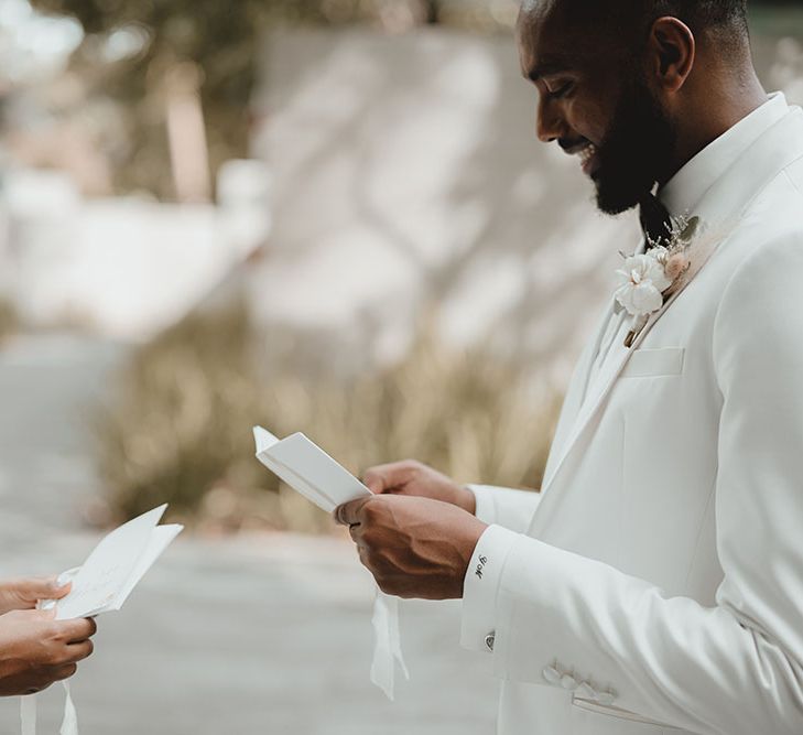 Bride & groom read personalised vows to one another after first-look during intimate moment 