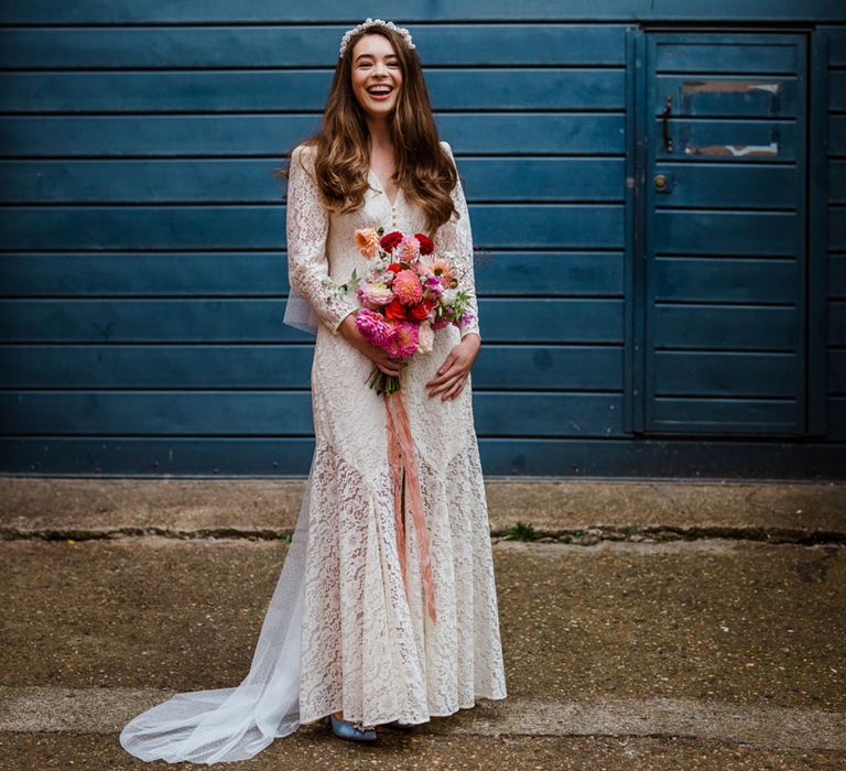 Bride in a traditional wedding dress with long sleeves for a city wedding 