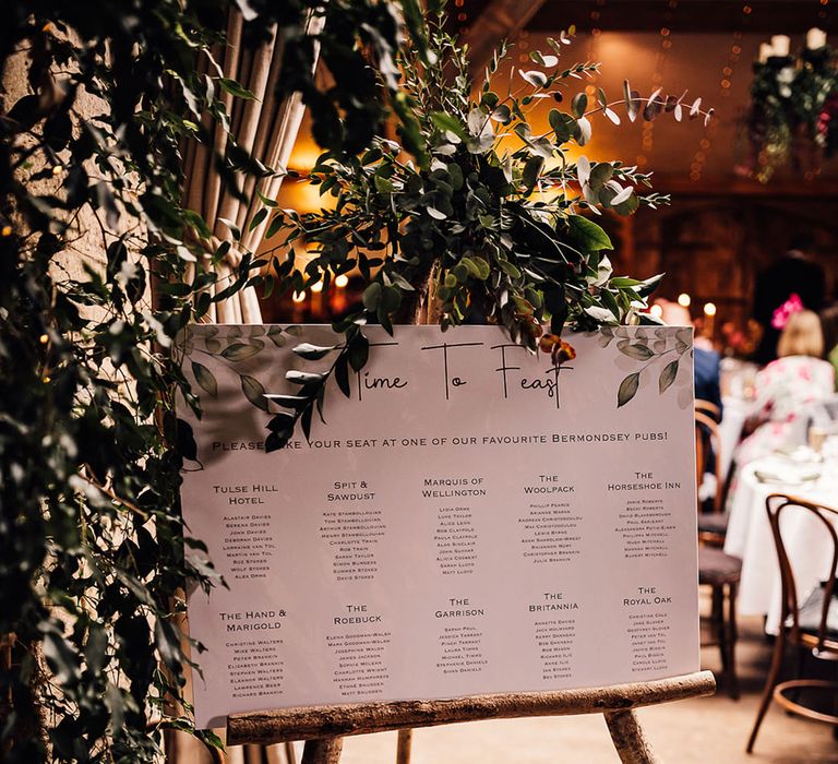 Simple and minimal wedding table plan with a leaf design and all the tables named after the couple's fave pubs 