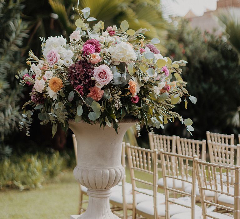 Garden rose, peony, carnation, eucalyptus and dried flower floral arrangement in large ceramic pot 