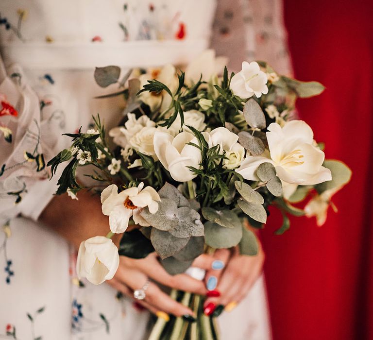 White flower wedding bouquet with natural foliage 