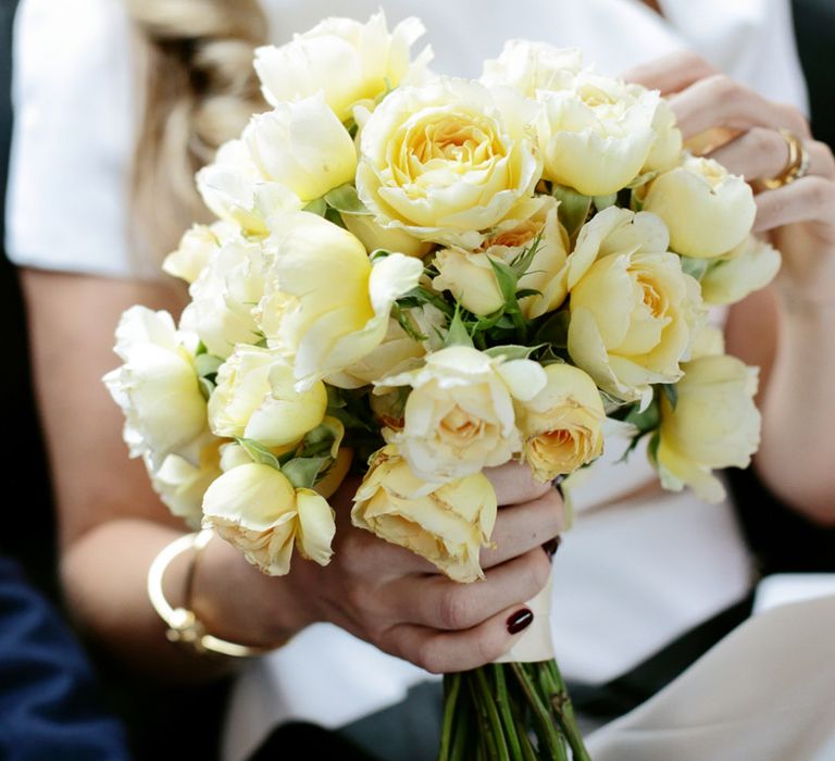 Small round bouquet of yellow roses for yellow wedding theme 