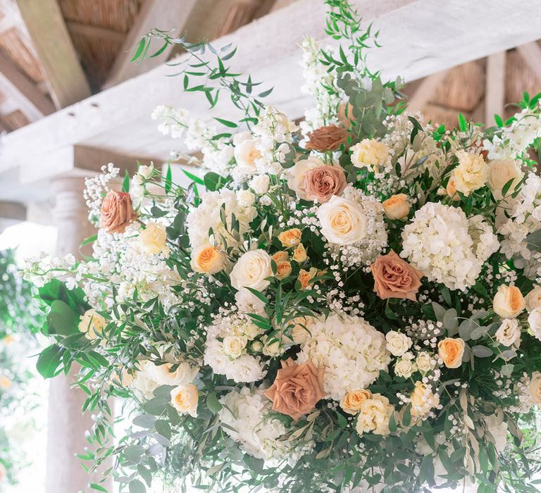 Yellow wedding flowers with yellow, neutral and white roses, gypsophila and hydrangeas 