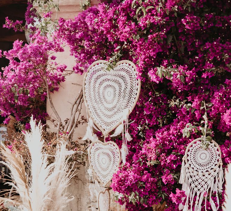 Boho wedding decorations with macrame dream catchers and candle lanterns for rustic destination wedding 