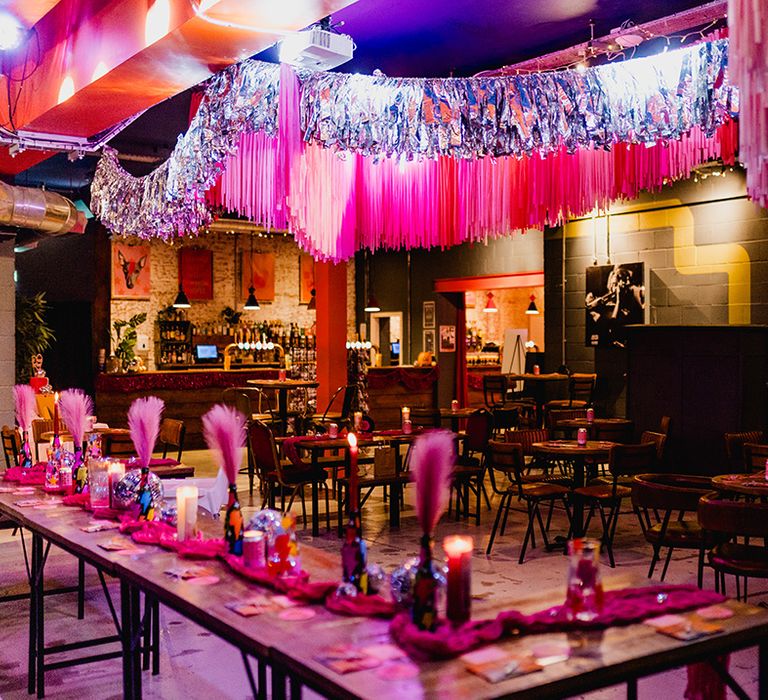 Silver and pink wedding streamers decorating the event space 