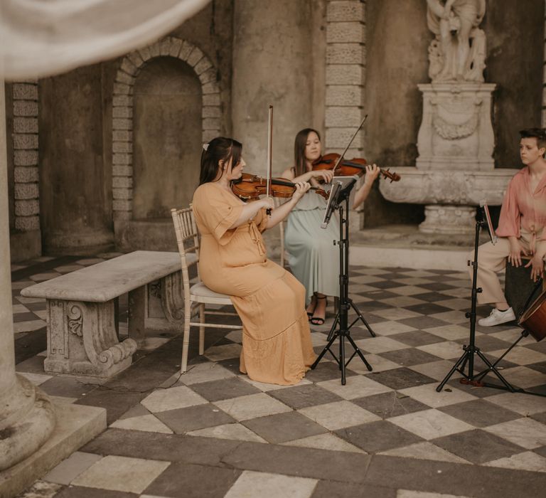 string quartet at outdoor wedding ceremony 