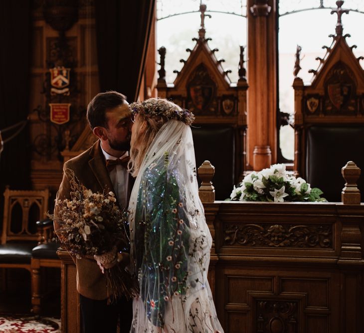 Bride in customised sequin jacket and embroidered wedding veil