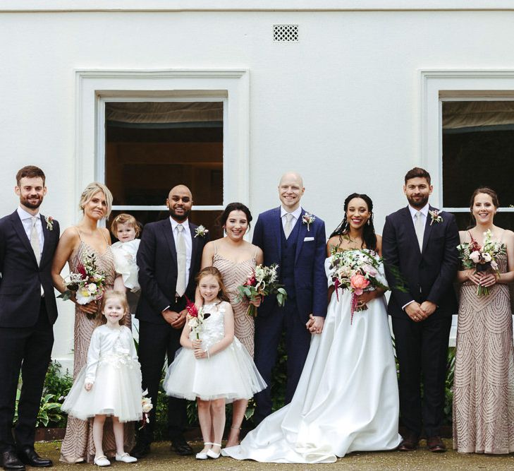 Wedding party portrait outside Morden Hall