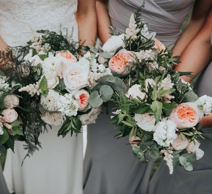 Bridal party bouquets with white and blush flowers 