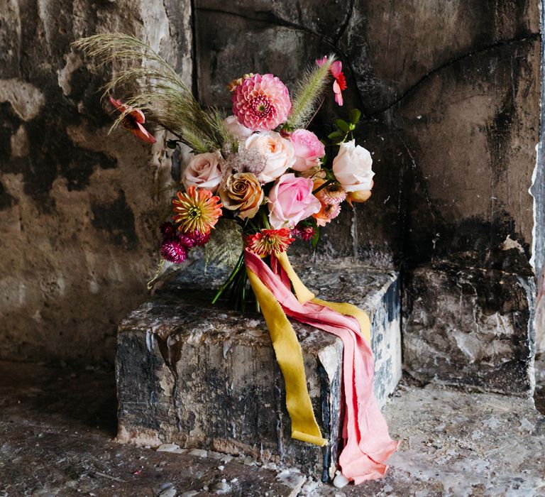 Bright pink wedding bouquet tied with ribbon 