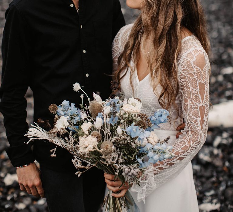 Wedding bouquet by Moody Blooms with blue and dried flowers