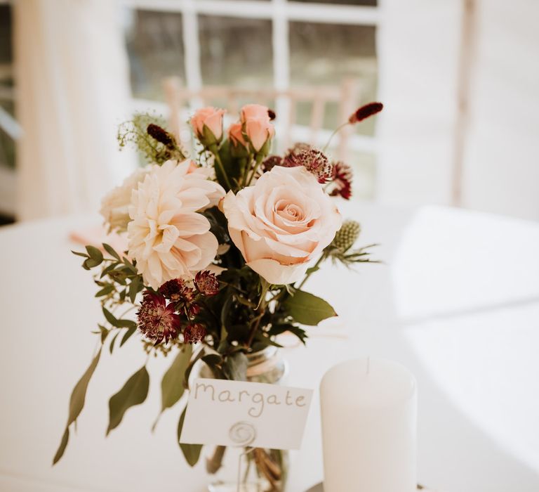 blush pink wedding flowers in glass bottle 