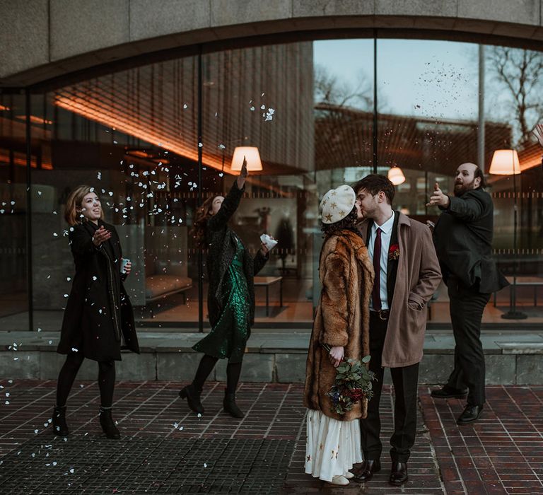 Confetti moment for bride and groom at intimate elopement