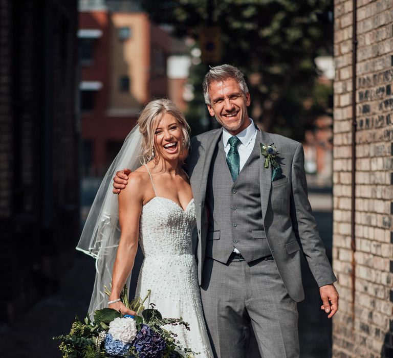 Bride & groom laugh together after wedding ceremony 