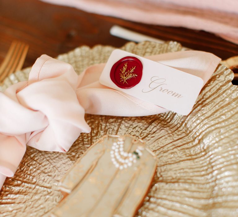 Groom biscuit on gold plate