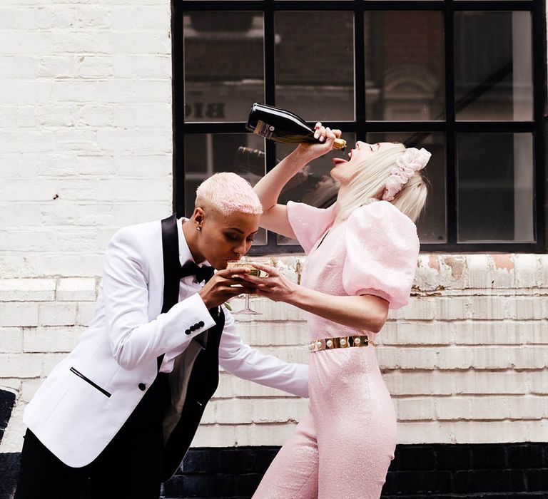 LGBTQ couple drinking champagne in the streets of Shoreditch 