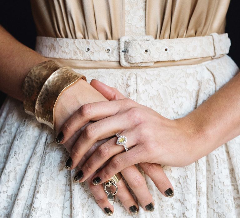 Bride wears yellow coloured diamond engagement ring and dark nail polish | Marc Millar Photography