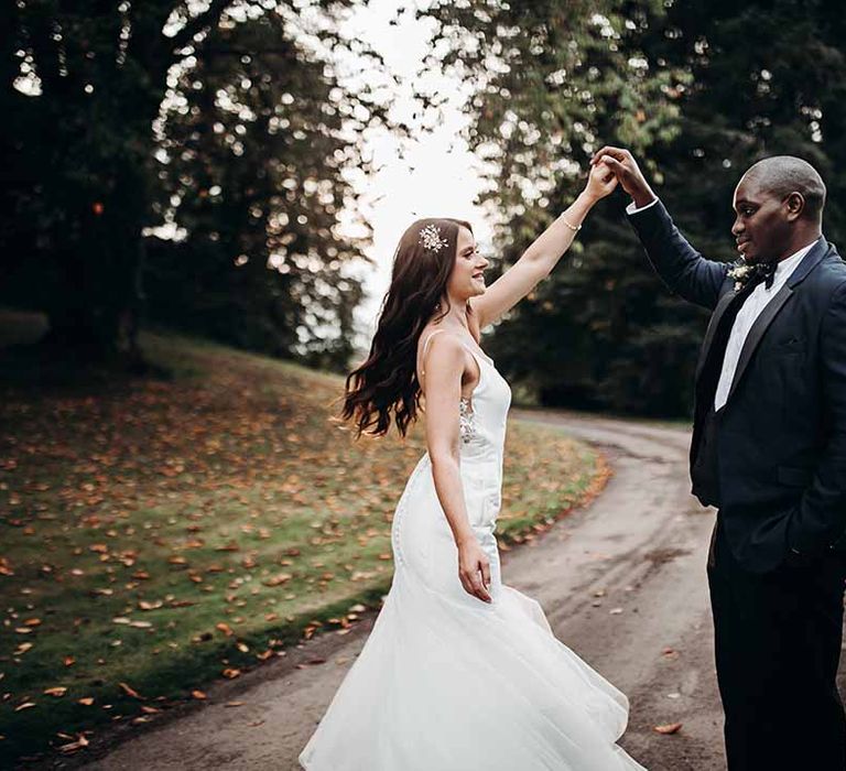 Bride & Groom dance in open outdoor setting in their autumn wedding at Cefn Tilla Court 