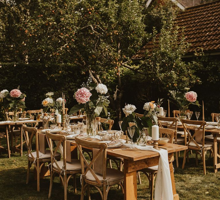 Rustic wooden tables for outdoor intimate reception