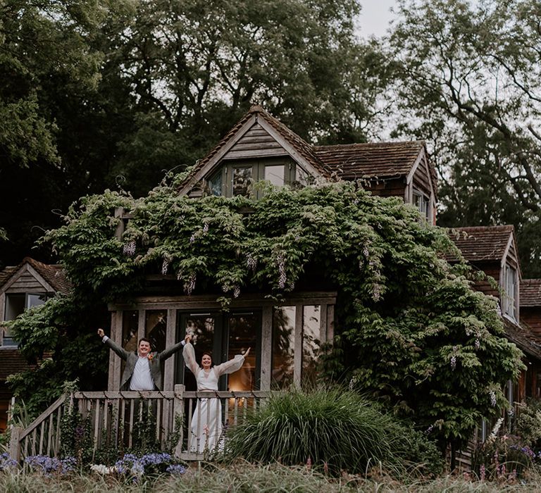 Bride and groom standing on the decking at The Copse Country House wedding venue 