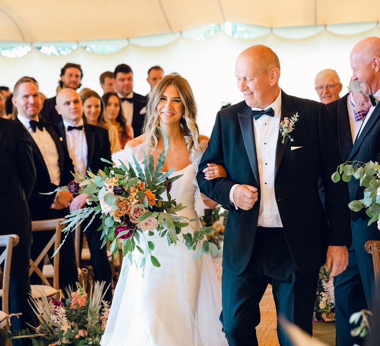 Bride walks down the aisle in Halfpenny London dress 