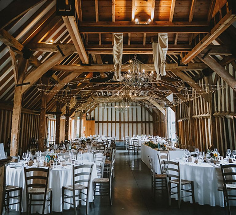 Southend Barns wedding venue rustic styled barn with exposed beams and fairy lights