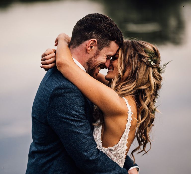 Bride and groom embrace on their wedding day 