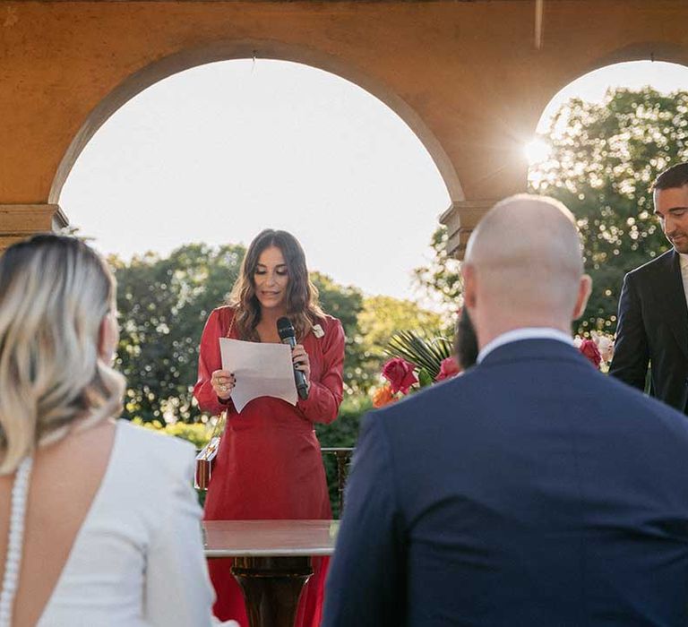 Bride & groom during wedding ceremony outdoors in Florence Italy 