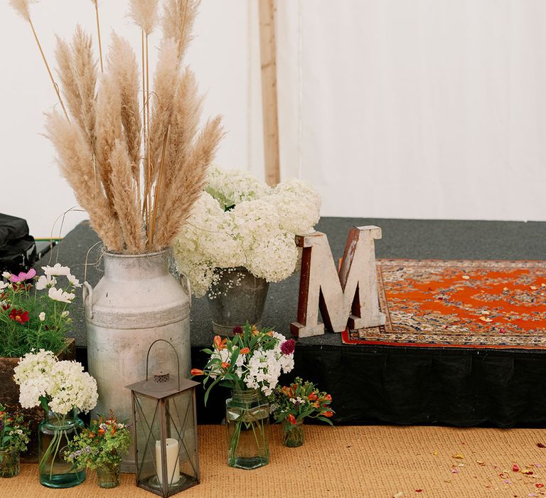 Staging area complete with pampas grass and personalised lettering 