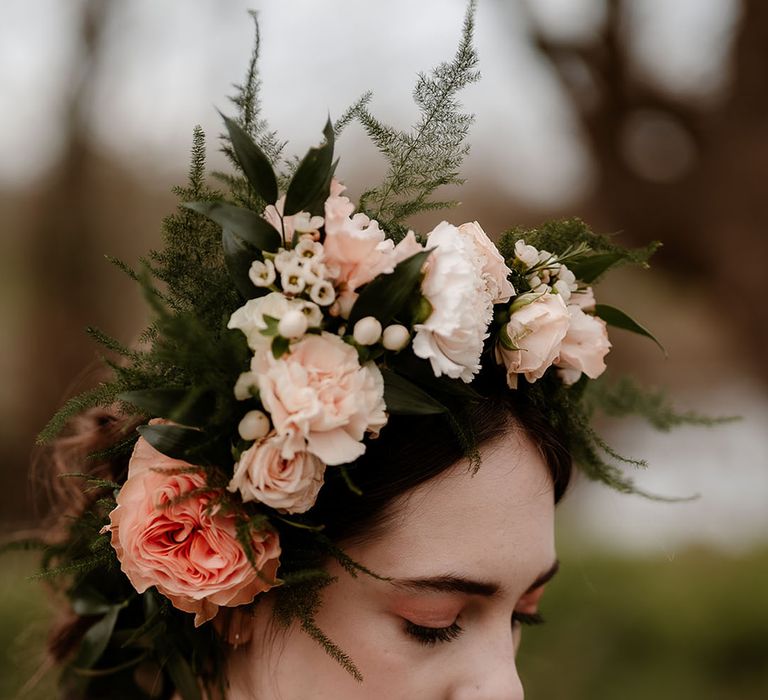 Bride wearing a pink rose and carnation bloomsy flower crown 