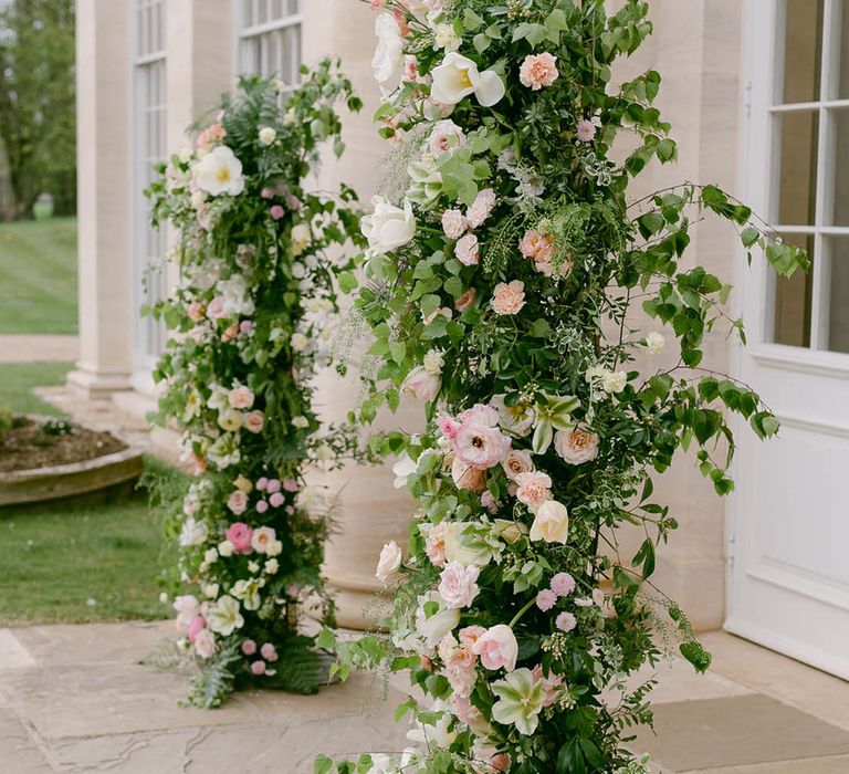 Pink and white wedding flower column decoration 