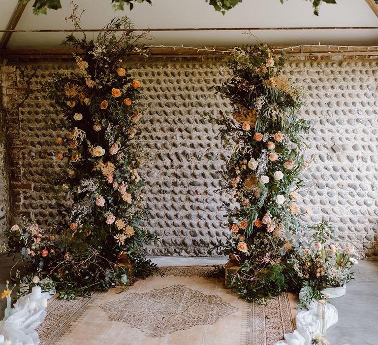 Asymmetrical wedding column flower arrangements for rustic Montague Farm wedding in an autumnal colour palette 