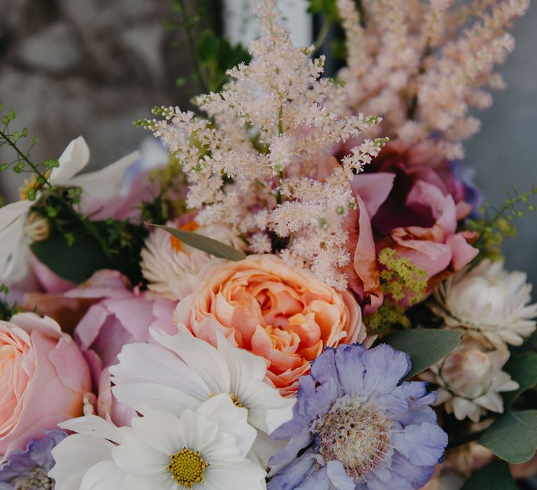 Homemade pastel floral bridal bouquet with seasonal flowers 