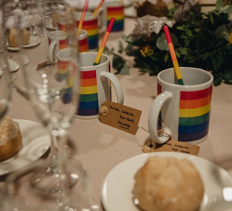 multicoloured Pride mug and pencil wedding favours 