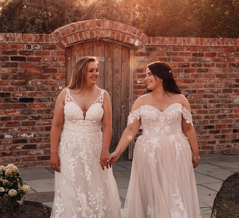 LGBTQIA+ The Oakwood at Ryther wedding venue with two brides wearing lace wedding dresses 