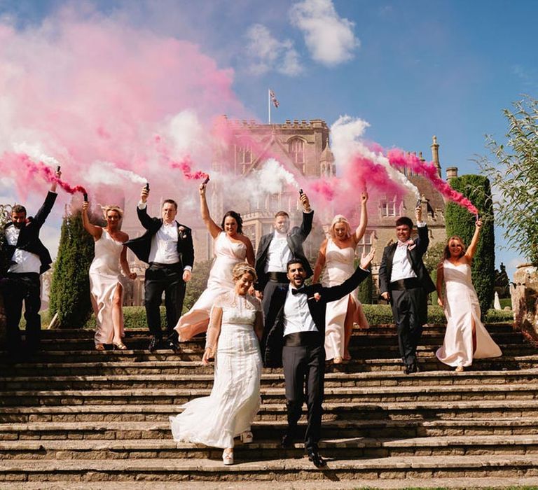 Pink and white smoke bomb wedding photo of the wedding party for pink and Moroccan theme wedding 