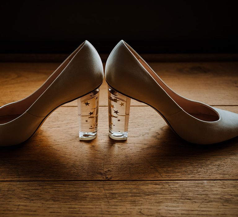 White pointed wedding shoes with a clear block heel with stars inside